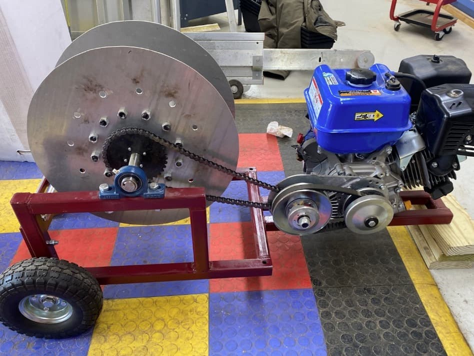 The drivetrain: the engine spins a torque converter, which turns the spool sprocket through #40 roller chain.